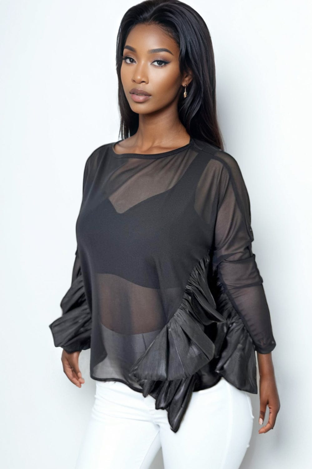 Blusa negra transparente con mangas largas